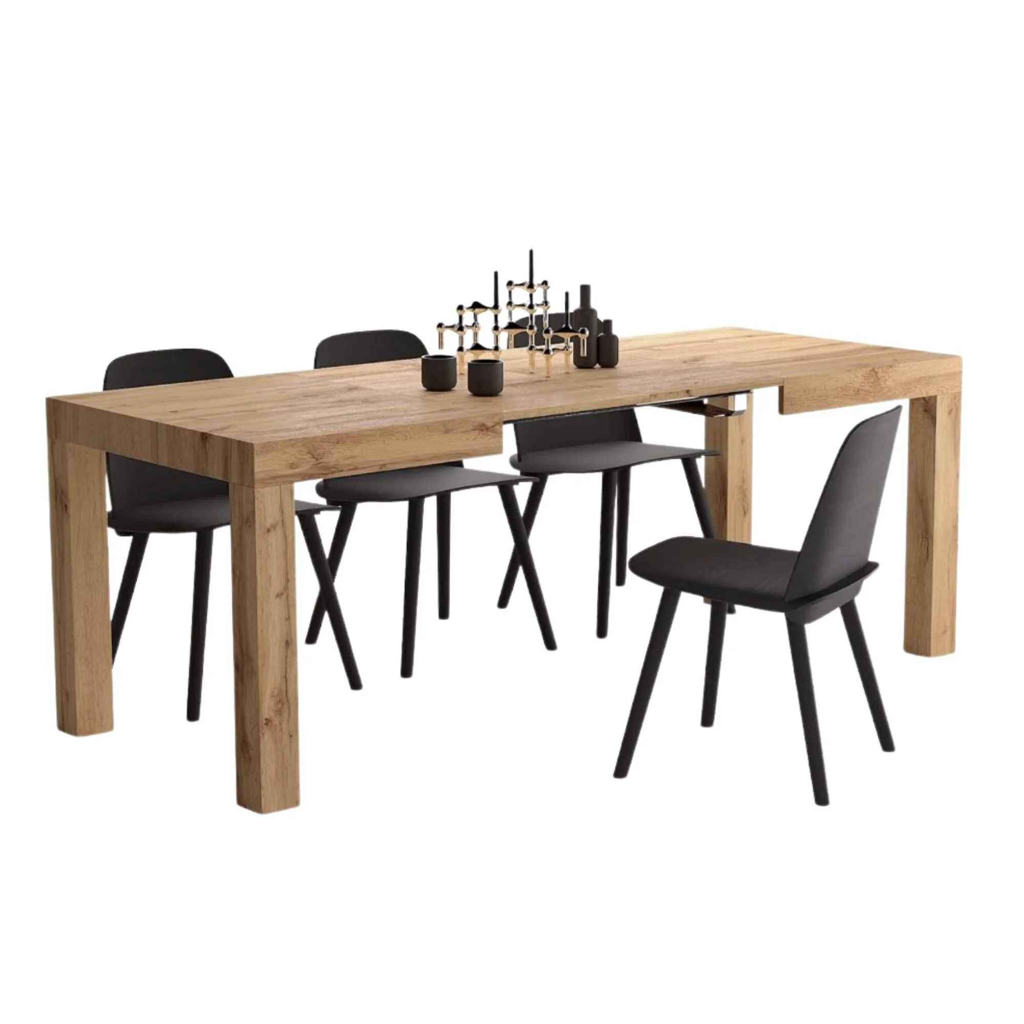 A long rectangular wooden dining table with black vases and a candlebra on it, with four black chairs underneath it - three on the top side, one on the bottom side