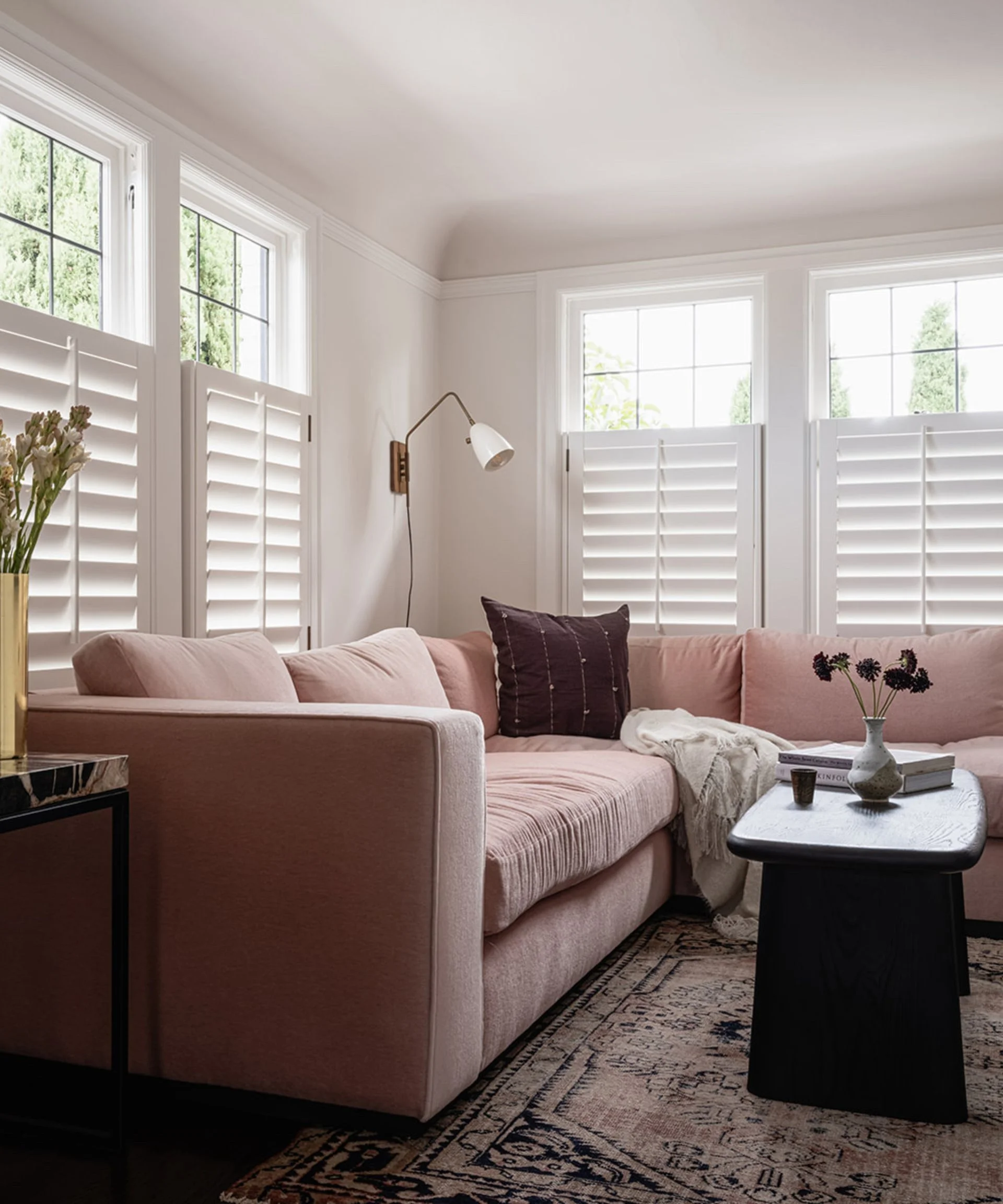 white living room with pale pink sectional