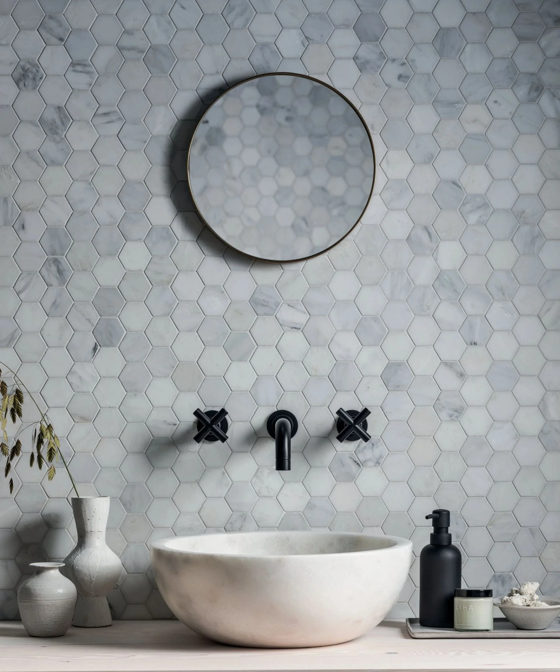Modern bathroom sink with black wall mounted taps