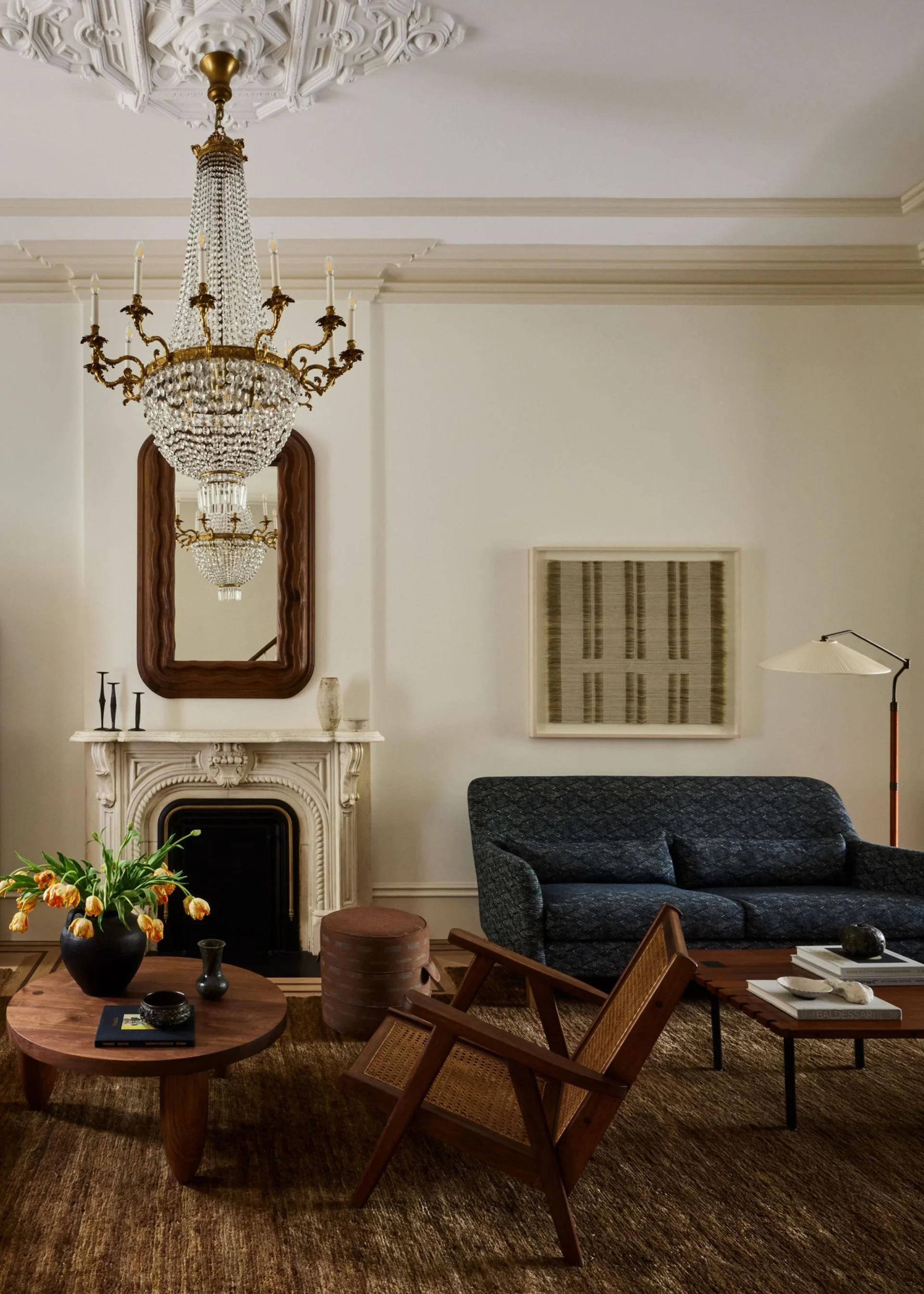 A mix of textures and light fixtures in a stylish living room.