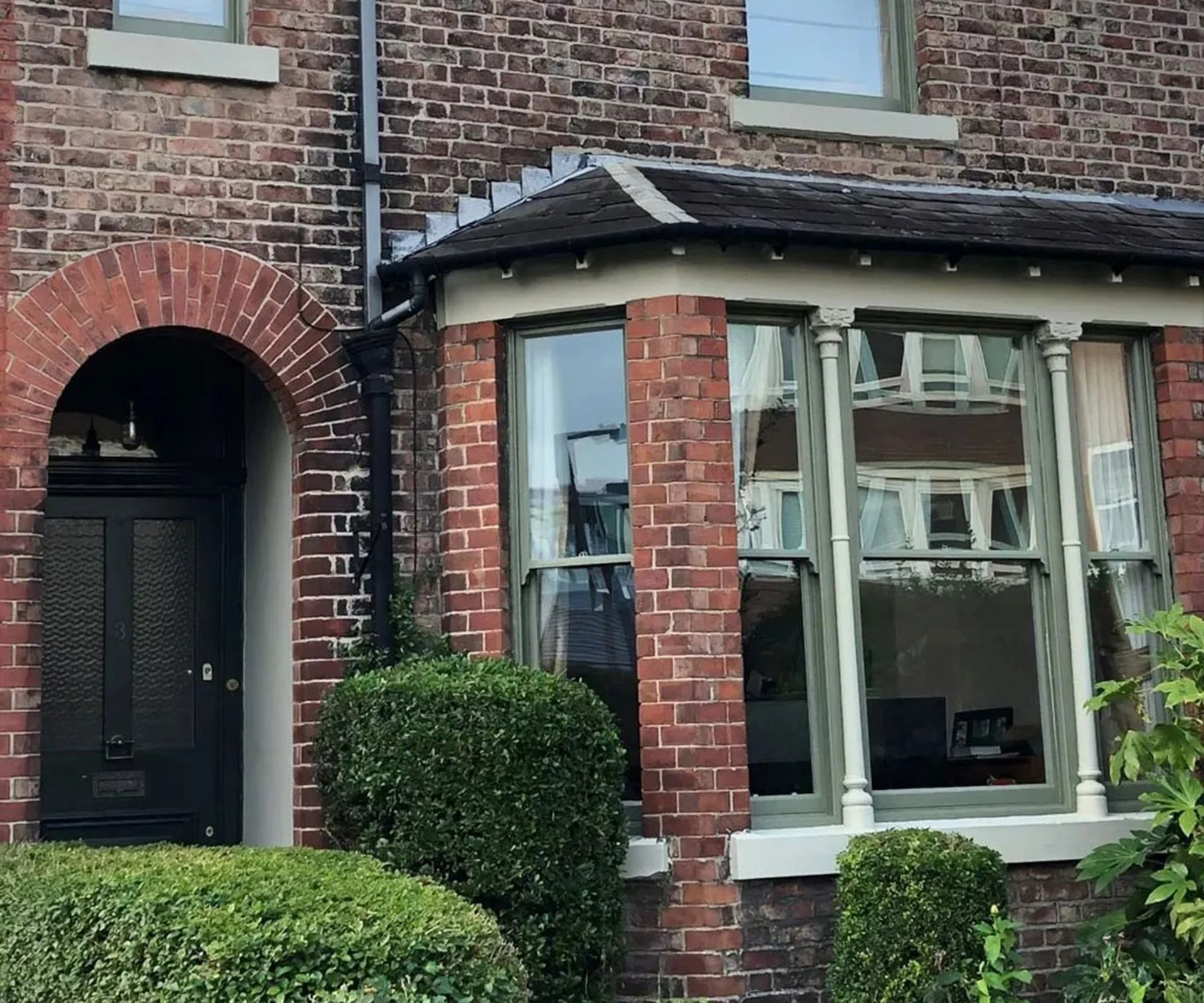 terraced house with green original sash windows