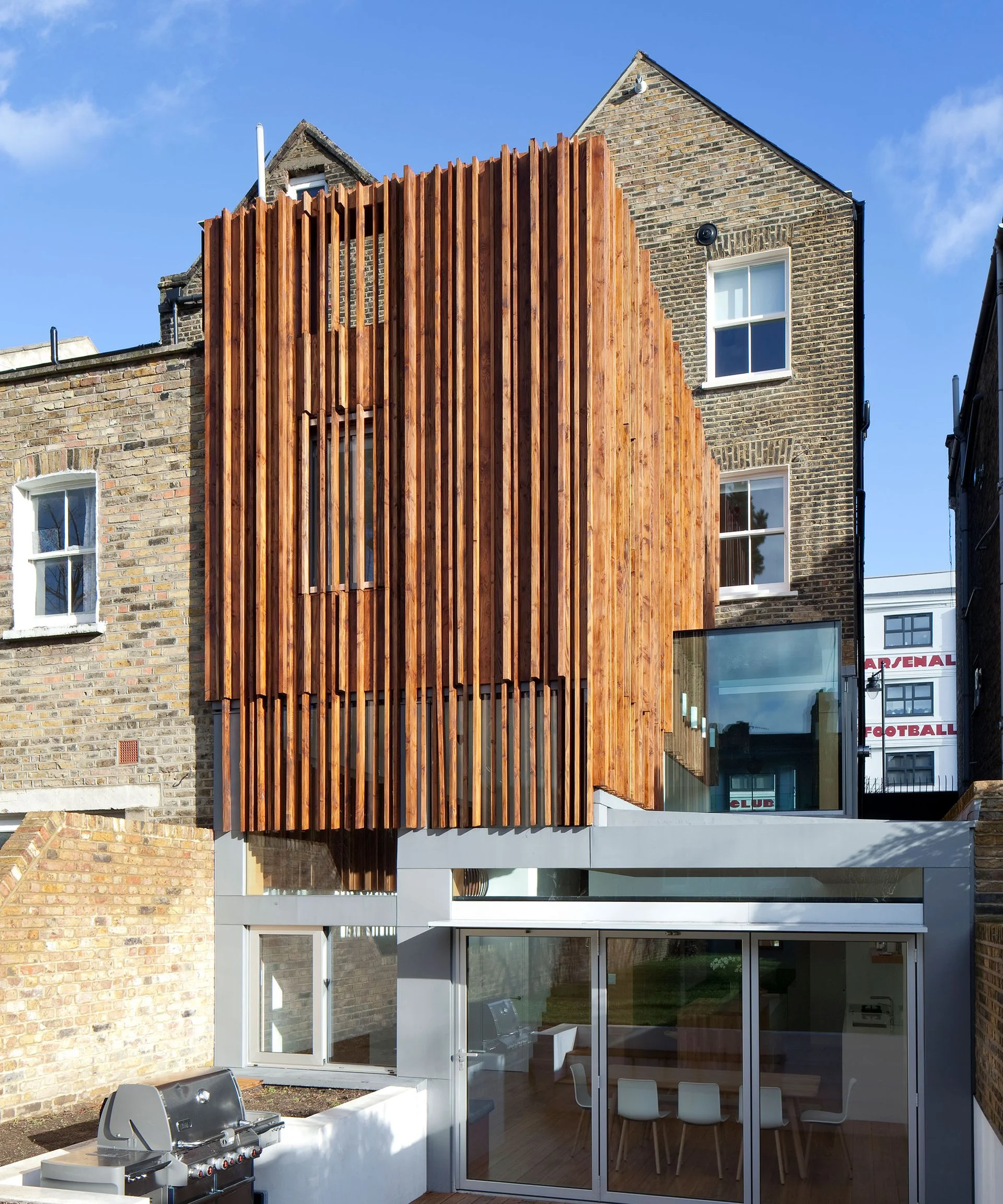 modern two storey extension with vertical brise soleil