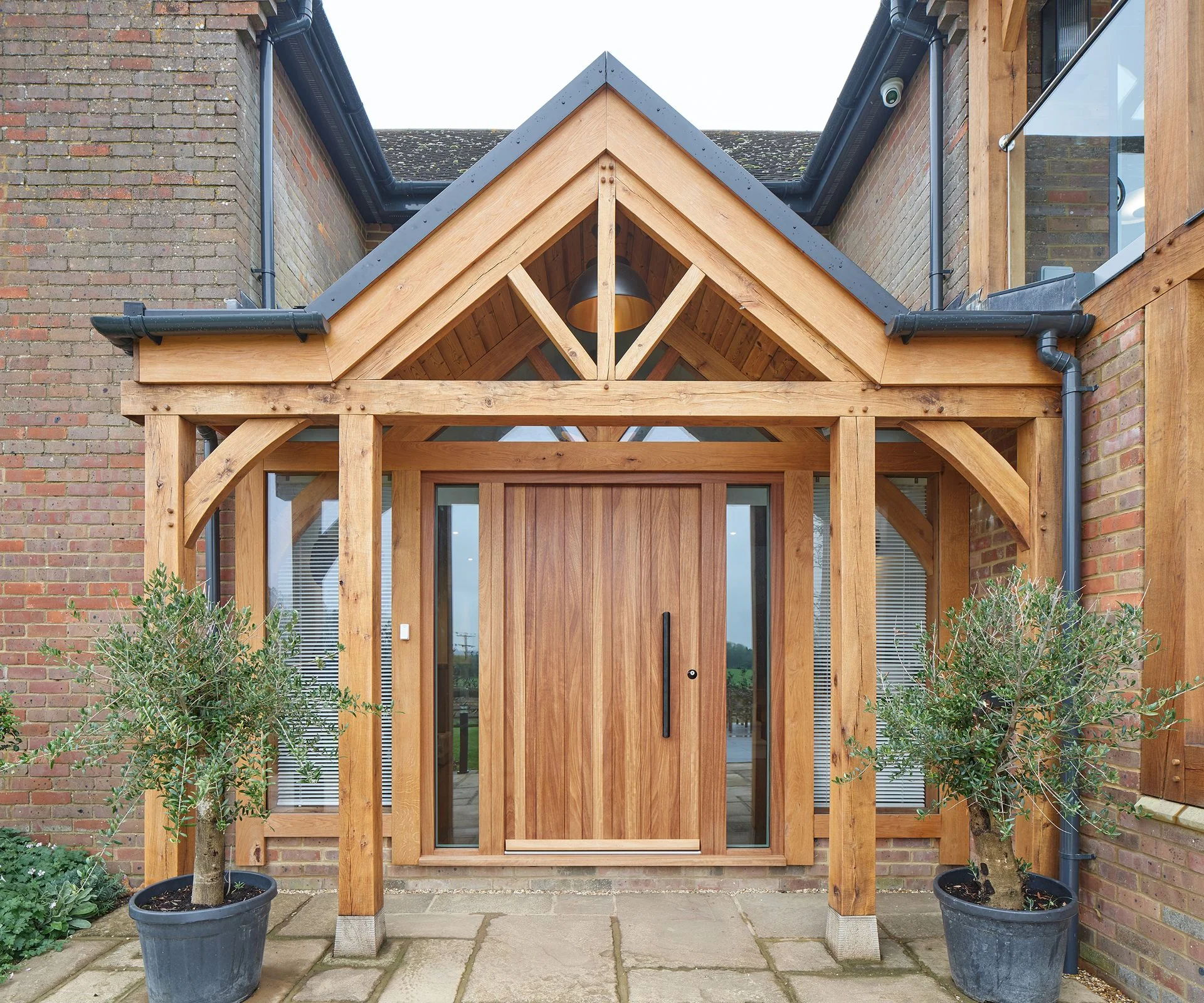 modern oak porch with large oak front door