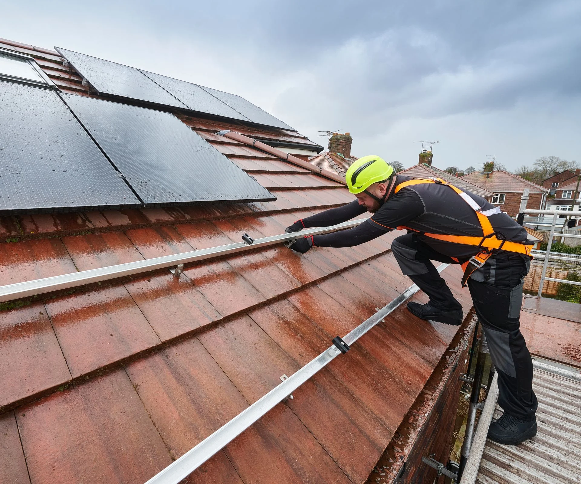 man working on solar panel frames