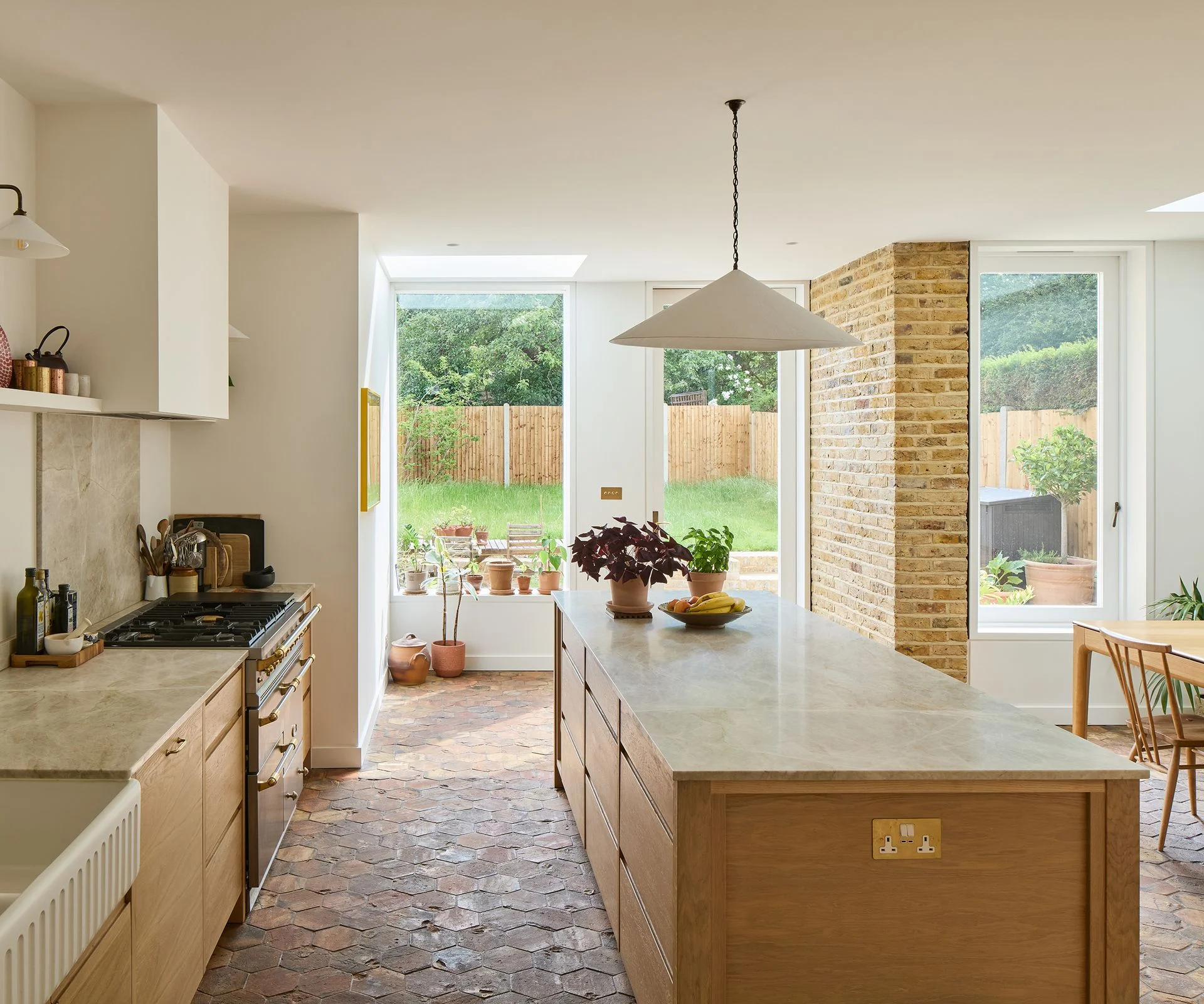 kitchen extension with wooden kitchen and hexagonal quarry tiles floor