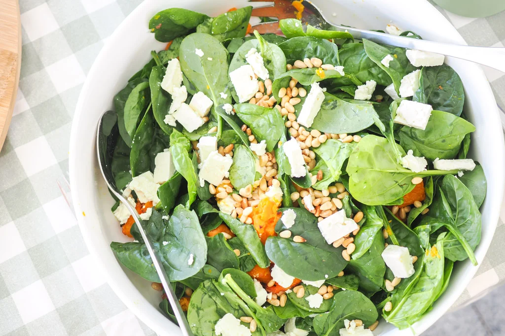 Roast pumpkin, spinach and feta salad with red onion, toasted pine nuts and honey balsamic dressing