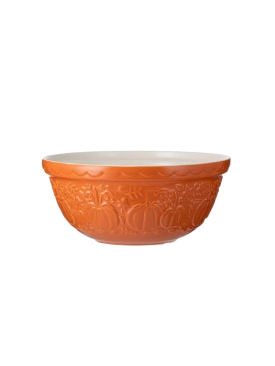 An orange Mason Cash pumpkin motif mixing bowl
