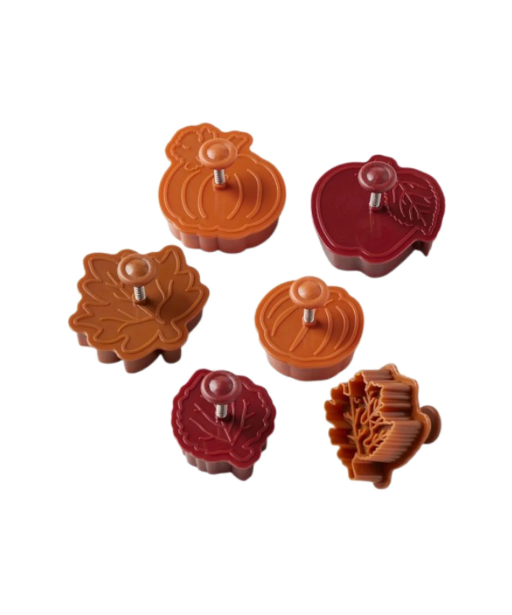 A set of cookie cutters with pumpkin and fall leaf shapes.