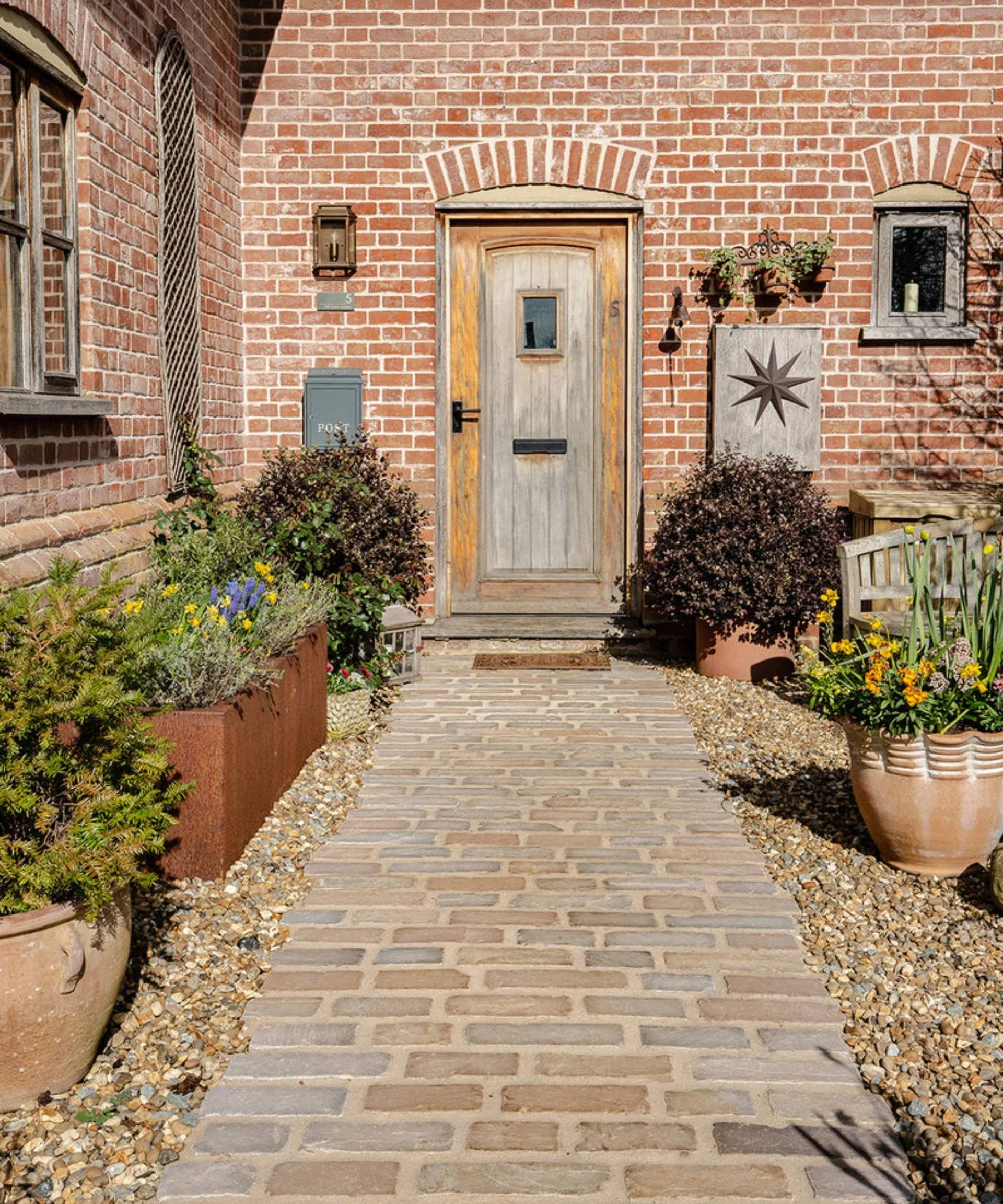 Hempstead Tumbled Sandstone Cobbles by Quorn Stone as garden path to front door